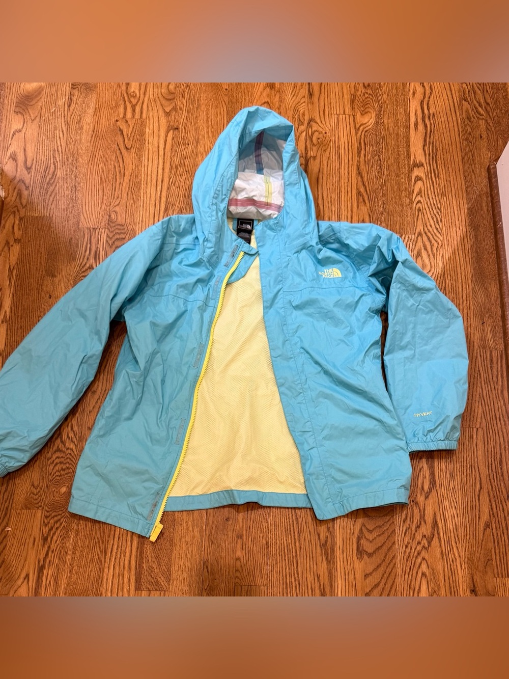 The North Face Kids Light Aqua Hooded Raincoat with Yellow Trim